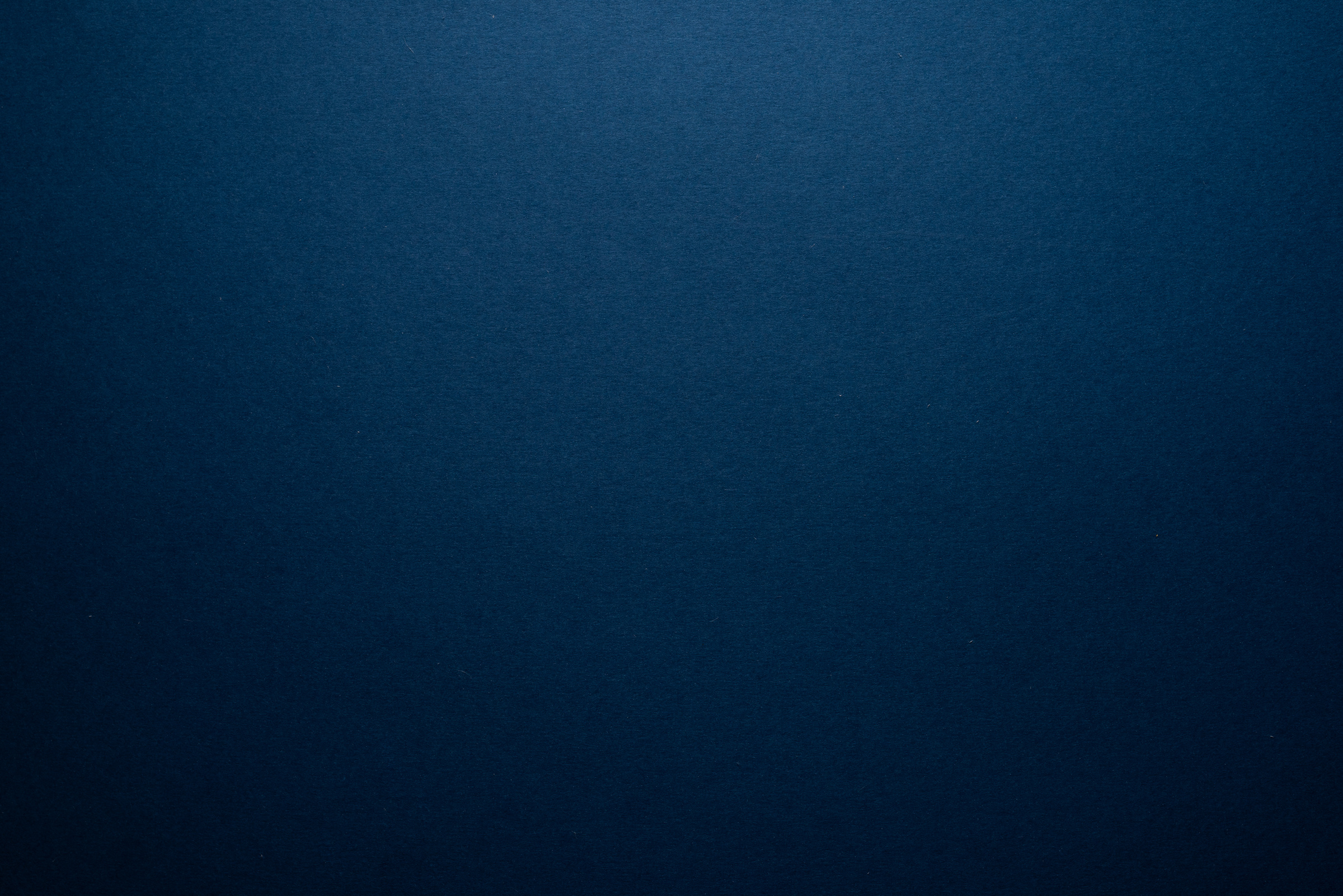 Empty dark blue background.